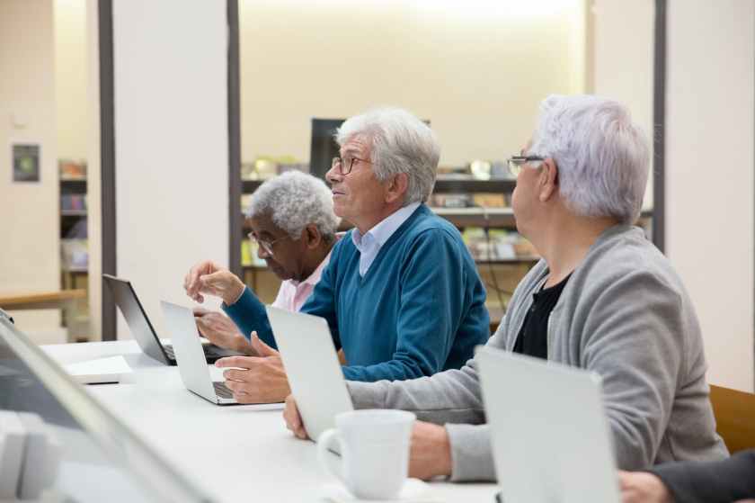 elderly people in a computer class